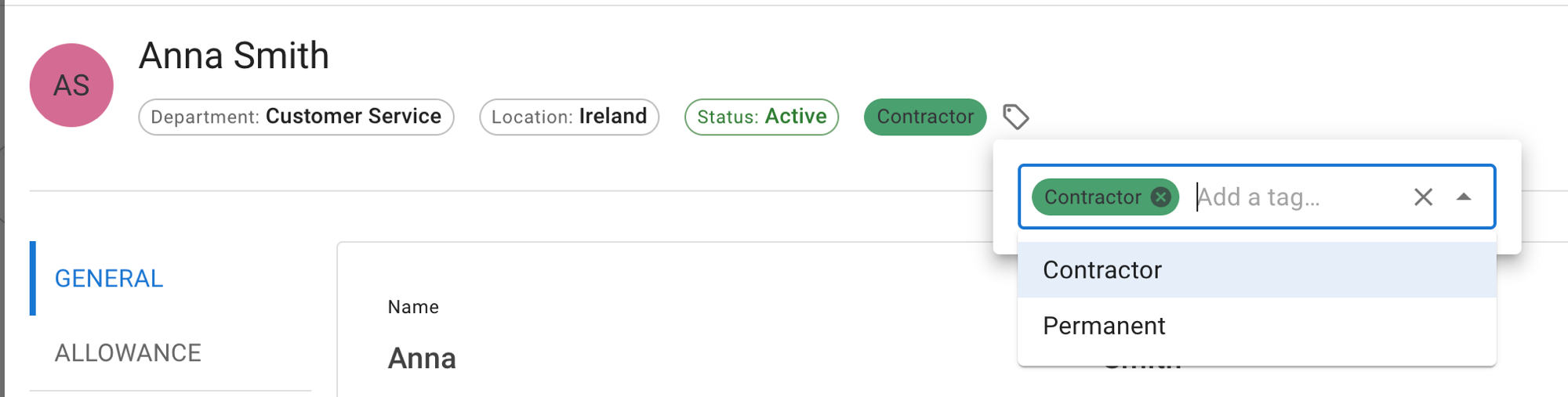 The top of an employee record showing department, location and status chips followed by a green Contractor tag and a tag icon, with the tag panel open below it: the Contractor chip with a remove cross, an Add a tag box, and the list of defined tags